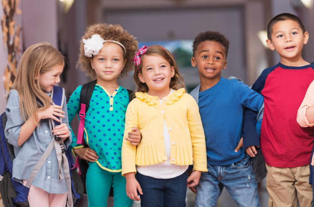 multiracial group of children in preschool hallway